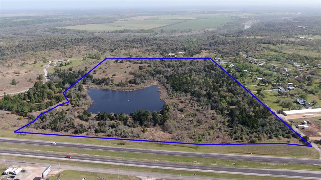 This 43 acres of beautiful transitional land boasts a jaw dropping 3.5 acre lake surrounded by large pines, live oaks and other native vegetation. With over 1200 feet of HWY 71 frontage and 1800’ of frontage along Colorado Circle, the opportunities for this property are endless. Electric is in place towards the back of the property where the owners have a well-appointed gathering area that features an awning for the vintage airstream, 3 yurts, water collection, septic and a separate storage barn.
The property is currently wildlife exempt creating a low carrying cost and borders LCRA McKinney Roughs on 2 sides.   
AQUA water has a 16” water main along the HWY 71 frontage and a 3” line along the Colorado Circle frontage.
There is no flood plain. Sewer is roughly 3500’ west on HWY 71 at an estimated cost of 750k to tie in.