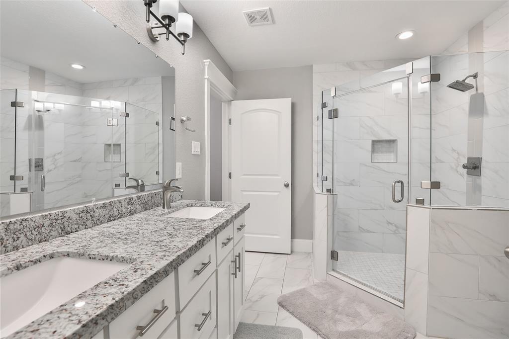 Beautiful primary bathroom with double sinks.