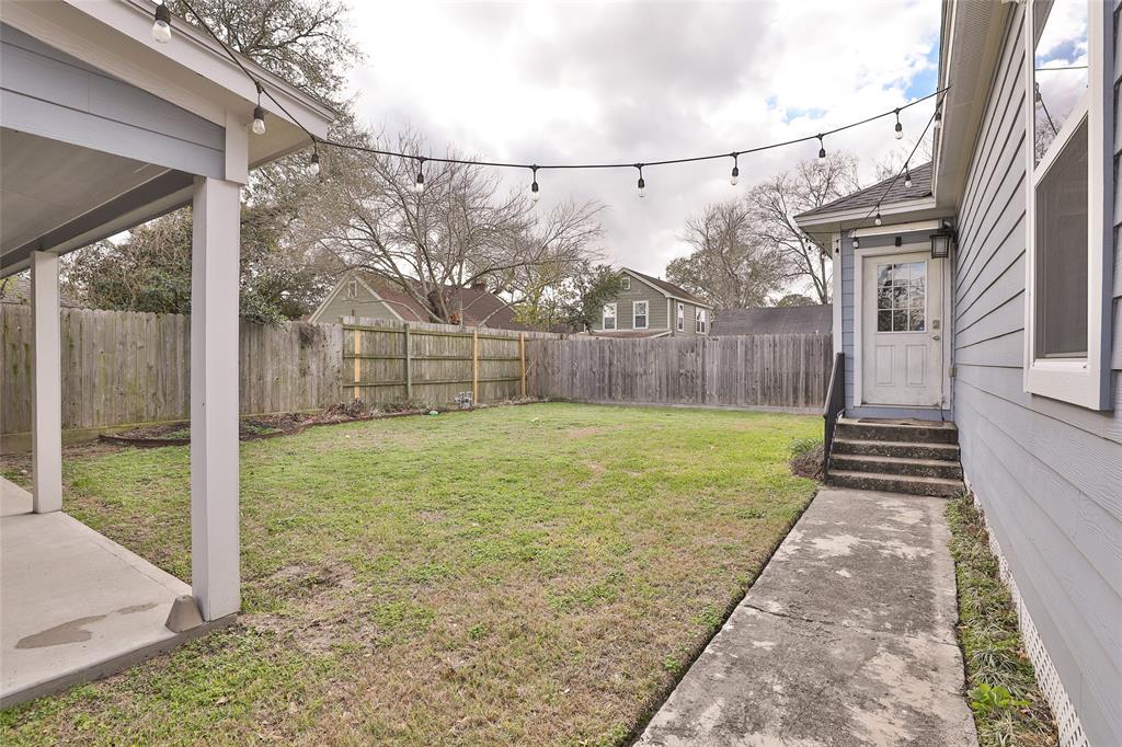 Spacious backyard is fully fenced.