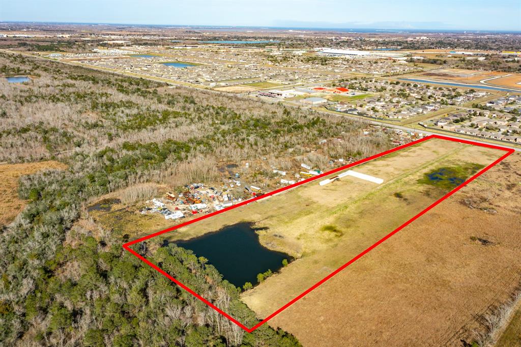 For Sale 9.5 clear acres with a small pond in the rear of the property--- 304 feet of frontage on FM2004 --Can be rezoned.  Water and electricity are available.  Across the street from a new subdivision..
