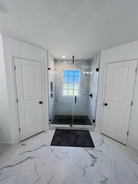 Look at that shower! TWO walk-in closets on either side