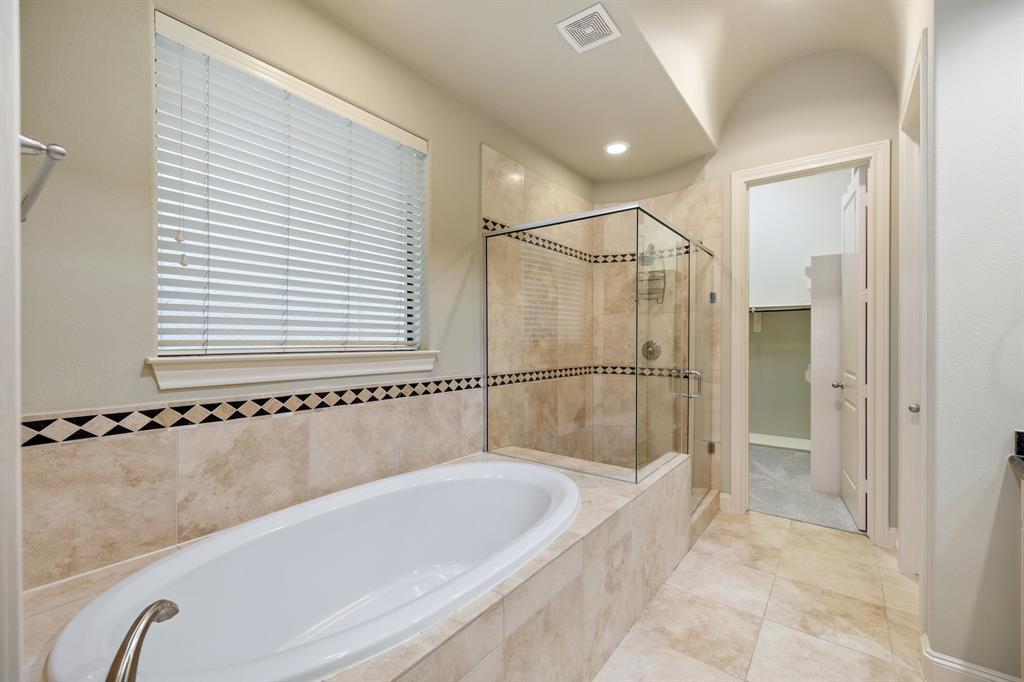 You'll also find a spacious shower and tub in the primary bathroom.