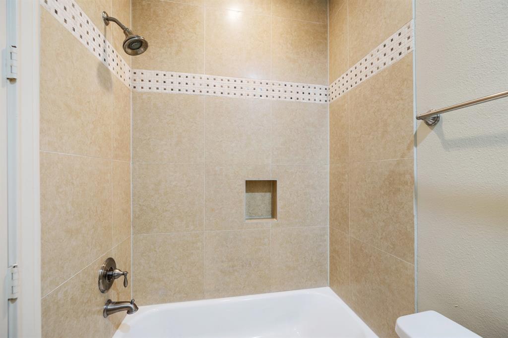 This secondary bathroom is located just off the downstairs bedroom.
