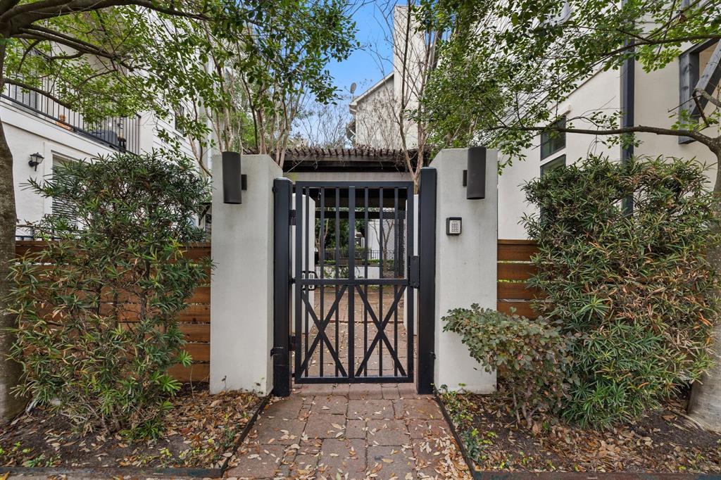 This pedestrian gate is located just off the central courtyard of this section of the development. The grounds are managed and maintained by the homeowner's association and their property manager.