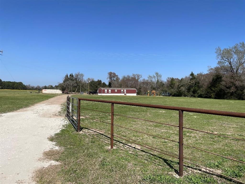 4068 An County Road 174 Grapeland, Texas Country living at its best! Come see this New 2022 single-wide MH on 14.79 Acres. The property is completely fenced with partial pasture and woods. Rolling terrain that borders the wet weather creek and trails for ATV rides. 105ft deep Water Well, with city water available at the road. The owner reports lots of wildlife on the property. 50Amp RV hookup, 10X20 shed, and playset stays! Bring your animals and start enjoying what the country has to offer. Call today for your private tour.
