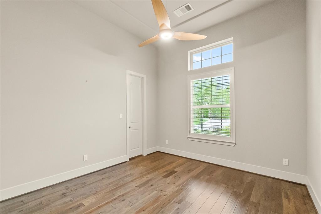 Study has a large window with view of the front yard.
