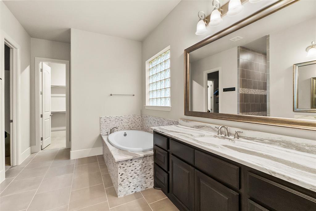 Looking past the tub into the second primary closet.
