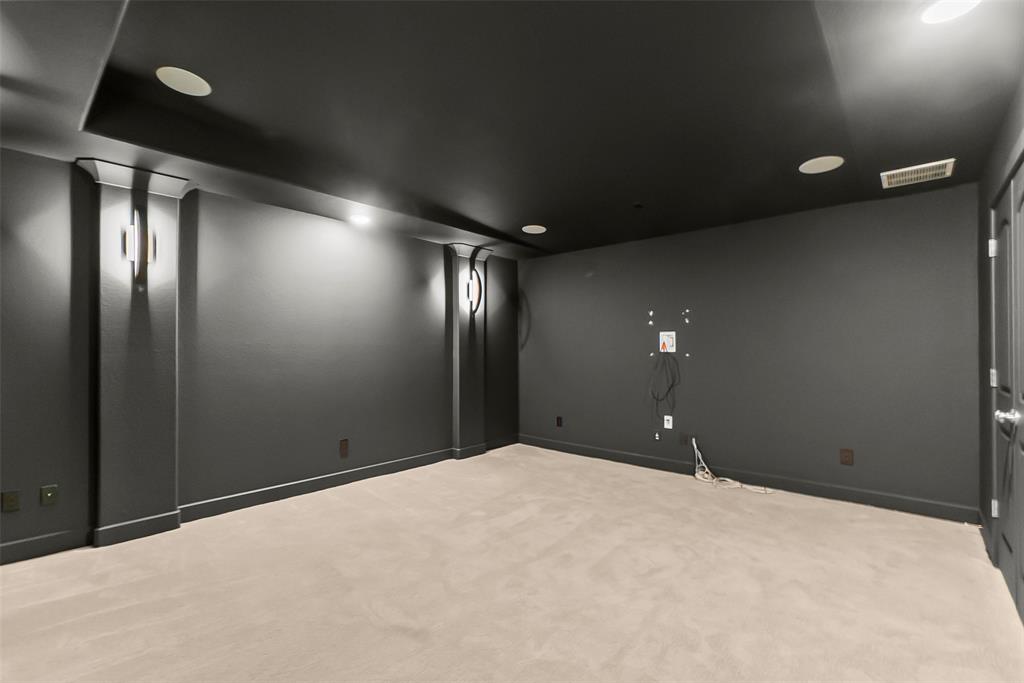 Seller added sconce lights and repainted the walls in a wonderful dark shade.