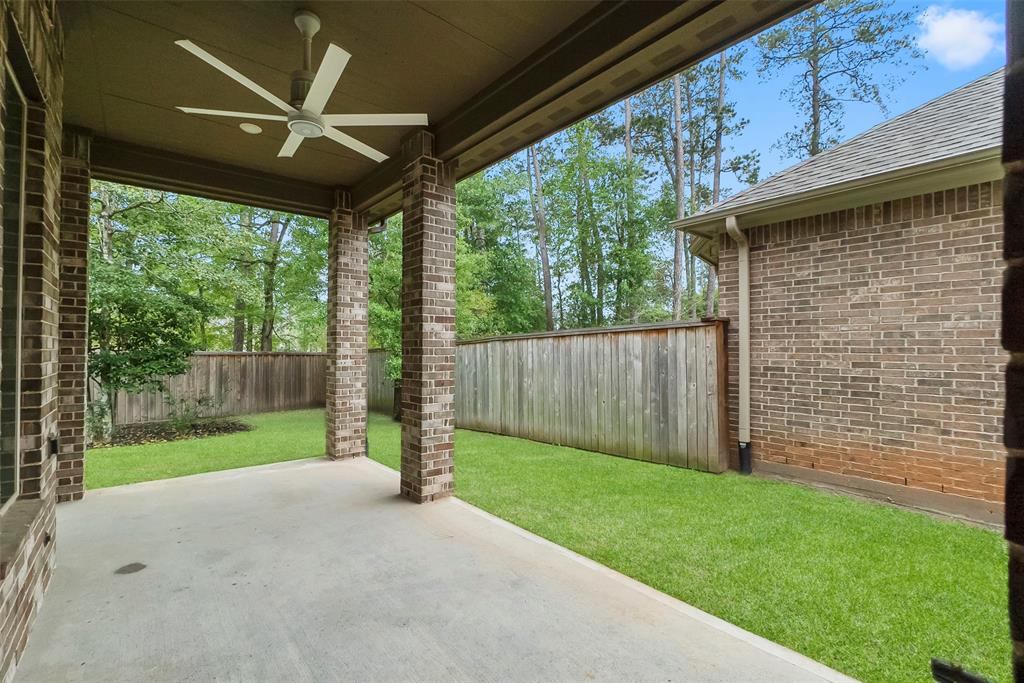 Wrap-around back patio. Seller-added ceiling fan. Tidy space with zero lot lines and no rear neighbors.