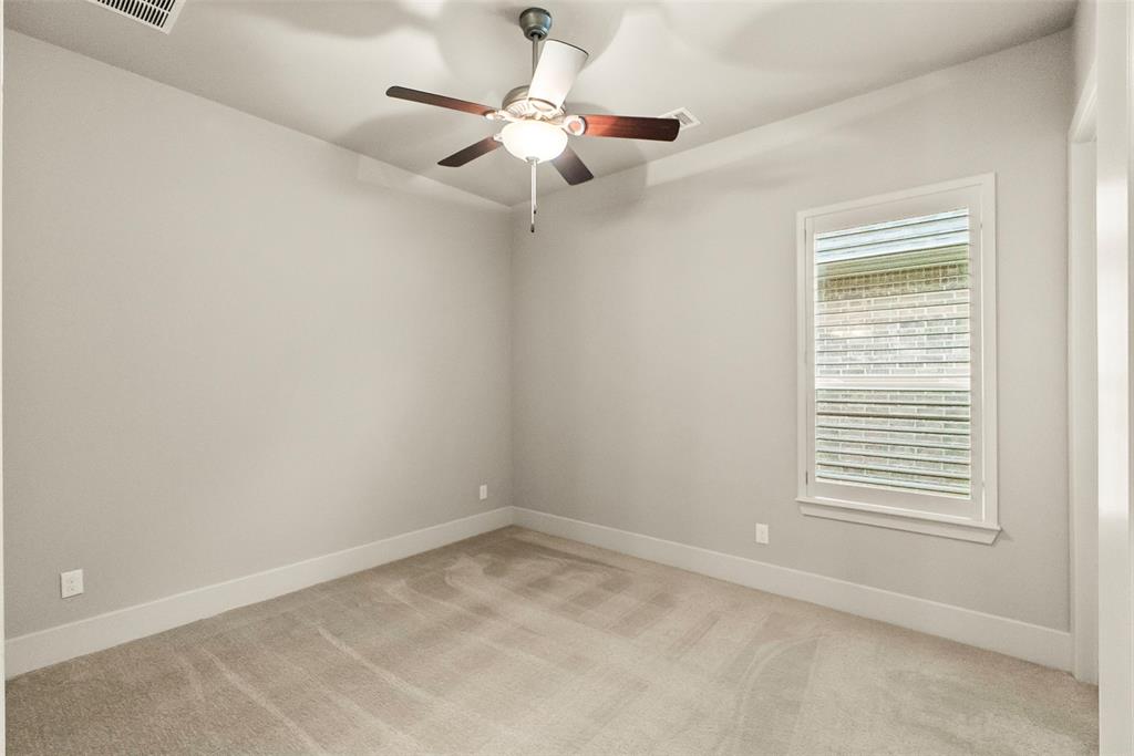 One of the front bedrooms with ensuite bath.