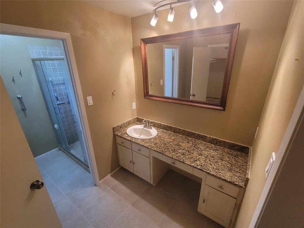 Private primary bedroom has a large bathroom with separate shower area.
