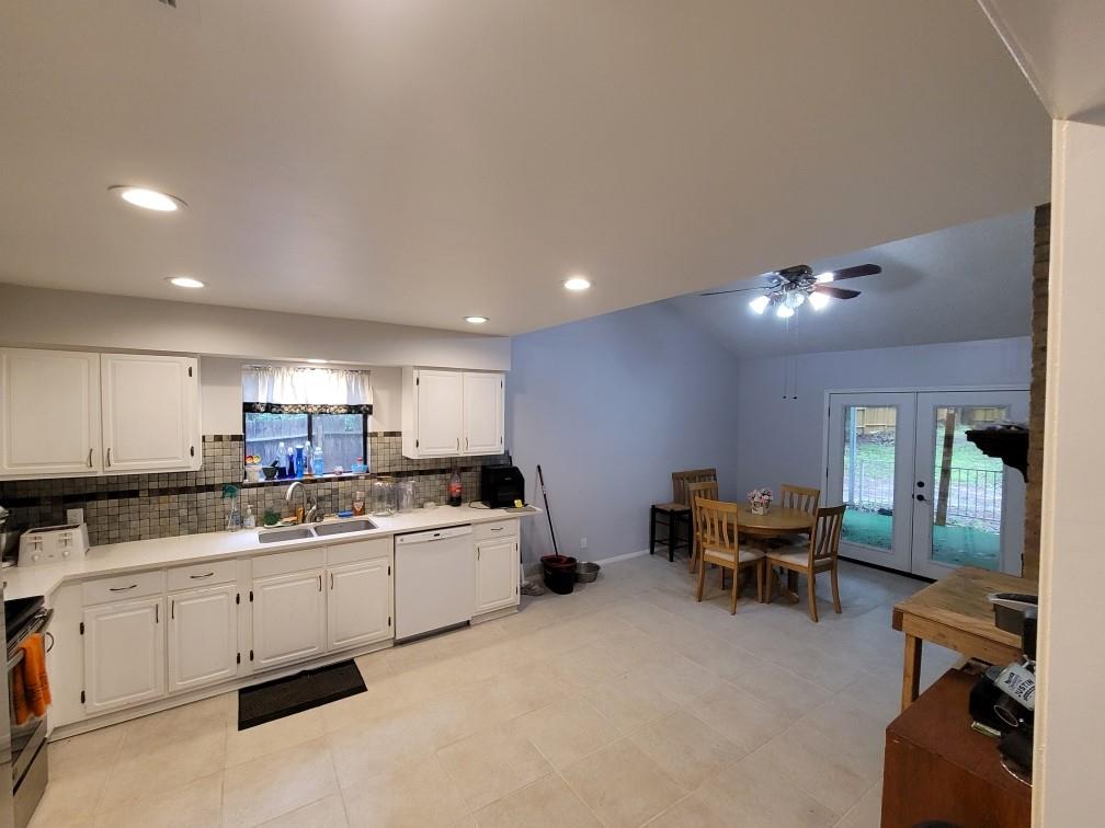 This huge Kitchen with a spacious area for dining and a double fireplace thats to the right of the patio doors.