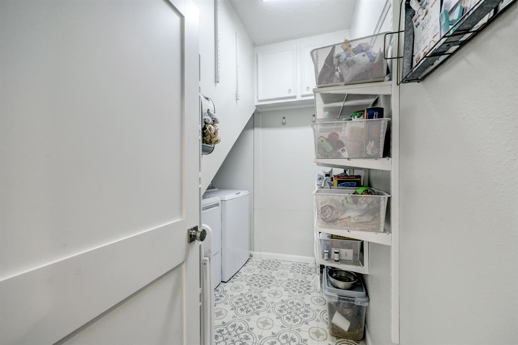 Last but not least on the first floor accessed by the kitchen is a tiled walk-in pantry where you'll also find the full size washer and dryer.