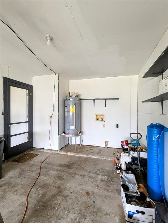 Garage and view of utility area.