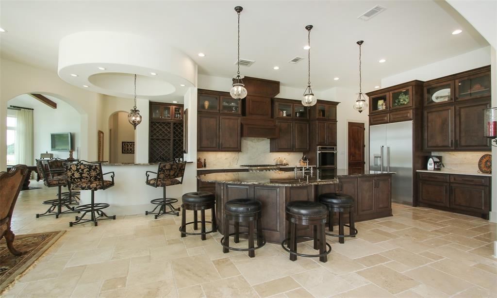 Massive kitchen with plenty of bar seating perfect for entertaining.