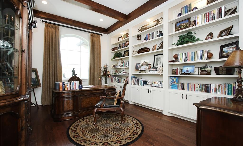 Can you say beautiful study?!  Floor to ceilings bookshelves to show off your favorite books and collectibles.  Glass doors lead to this home office so that you can have your privacy but still take advantage of all of the views.