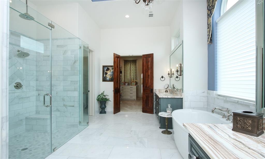 Amazing master bath rivals the best of the best with up to 14 foot ceilings.  It is truly a thing of beauty from the marble floors to the quarts counters.