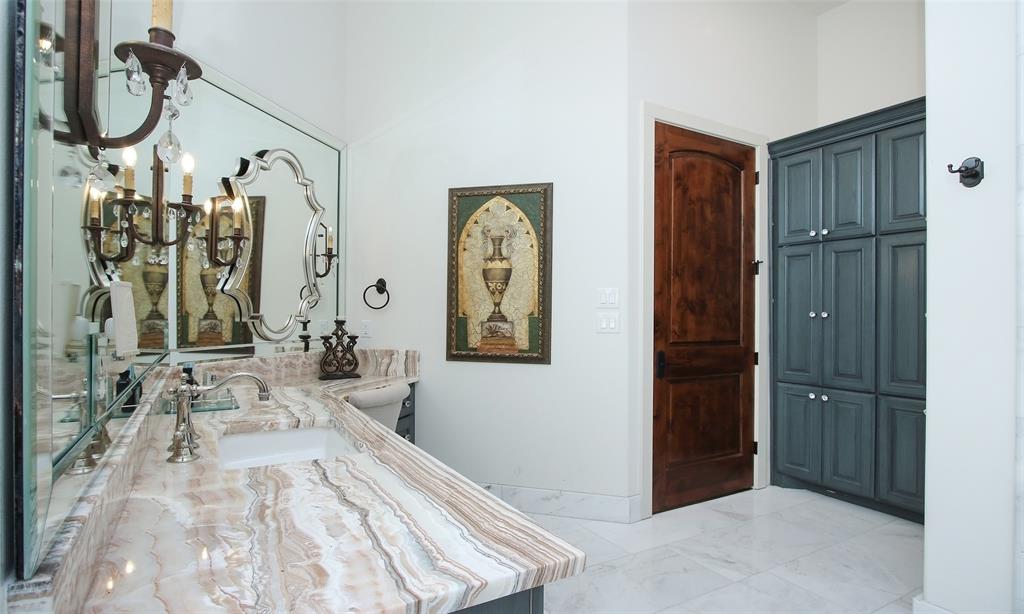 One more view of this exquisite bathroom with great built in storage.