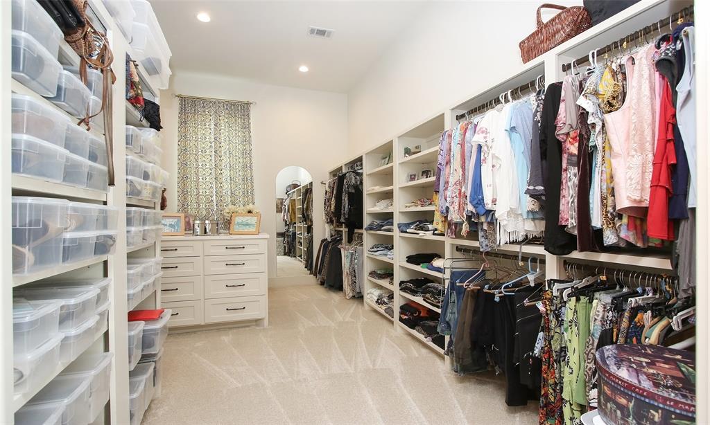 Ginormous closet with walls of storage. Hidden storage/safe room not pictured.