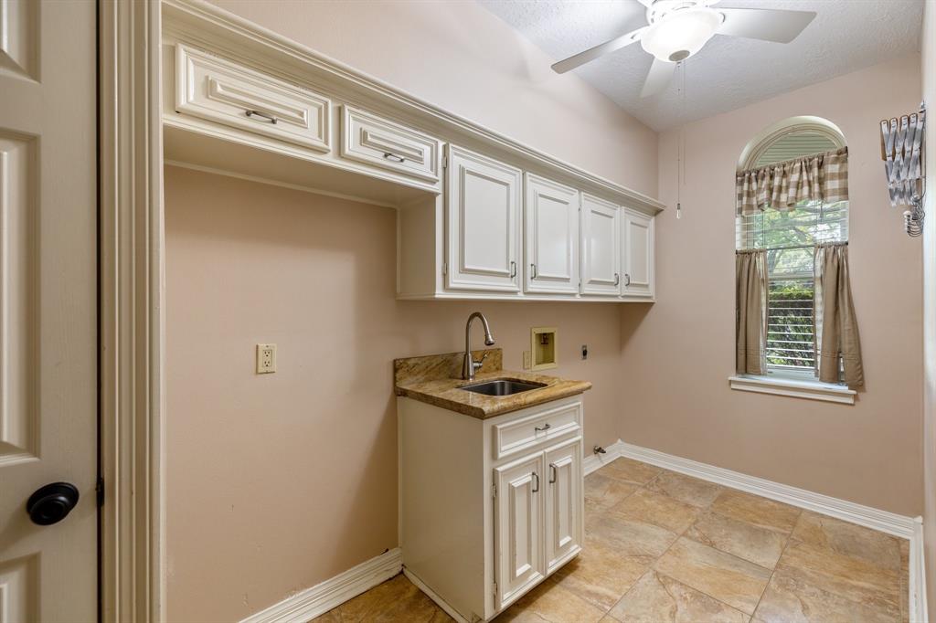 Utility room with plenty of space and storage.