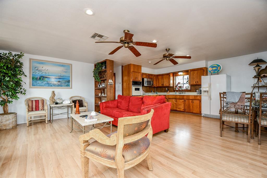 Your spacious living/family area warmly invites family and guests into the huge, blended open floor plan.