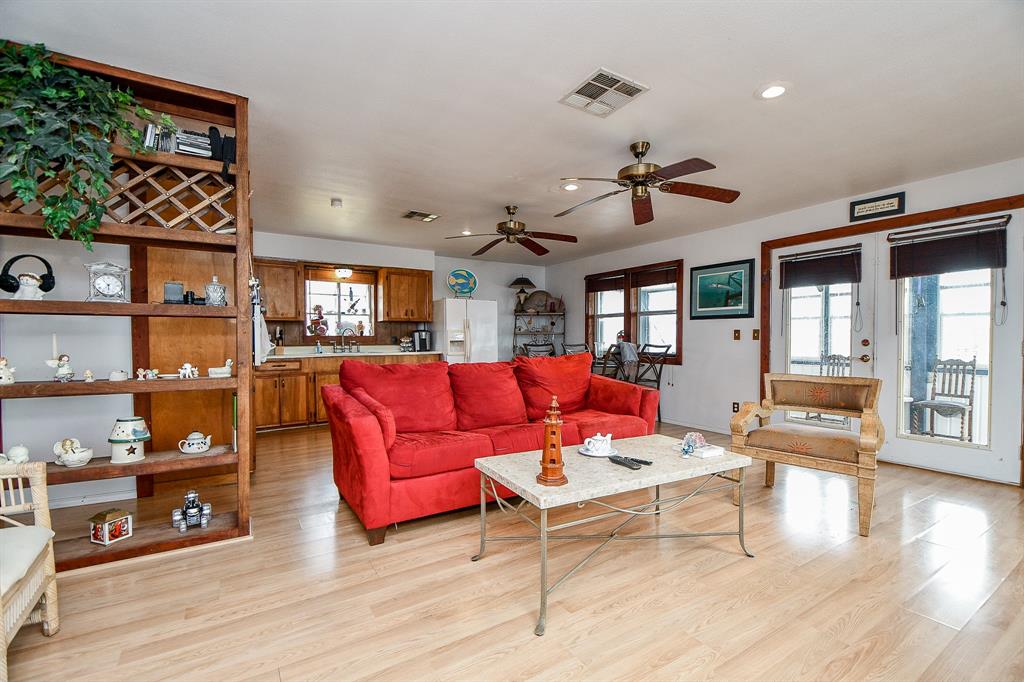 Big patio doors are comfortably convenient for access to the sunroom, or left open for balmy sea breezes.