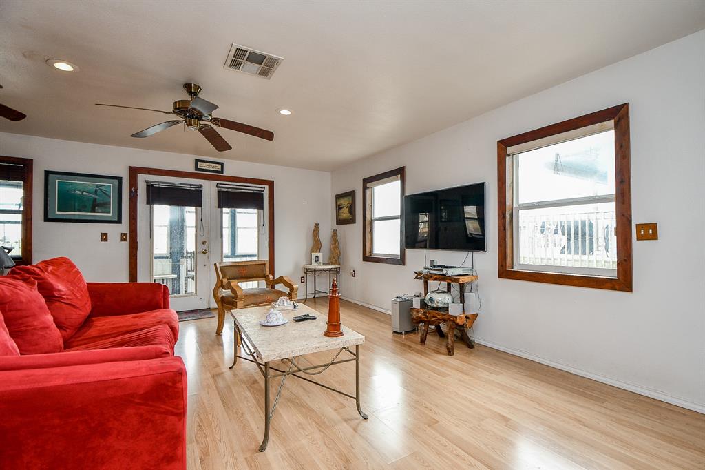 Cool tones on walls and easy-maintenence wood-look laminate floors complement the generous open, airy space!