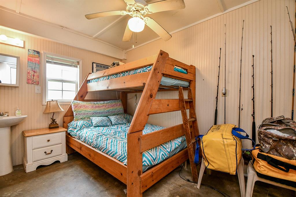What a cozy bunk space, that cleverly shares a private bath!