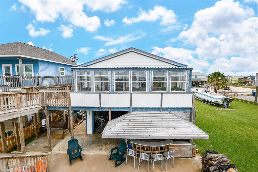 Walls of windows are just as impressive from the outside, as they are on the inside! This is a great view of your covered patio and bar!