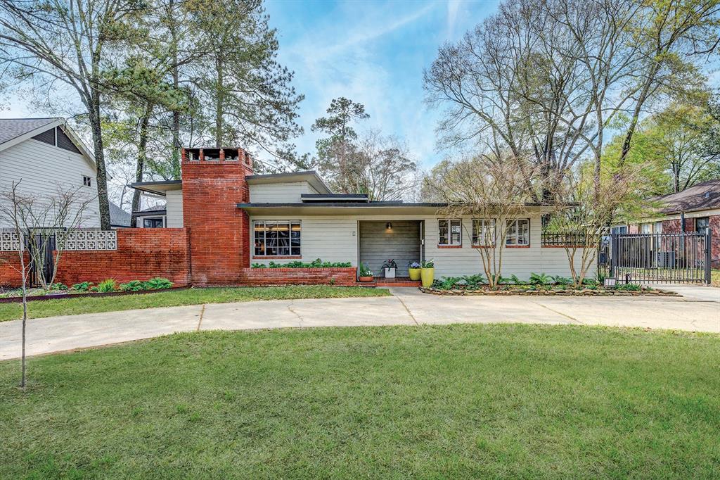 Historically significant Mid-Century Mod in Garden Oaks. Designed by Houston architect Allen R. Williams, Jr., the home is 1 of 3 remaining Century-Built Homes in the city. Constructed of hollow concrete tiles (response to material/labor shortage during WWII) it has energy efficiencies & open floor plan of living/dining areas w/ wing of beds/baths. Roman brick chimney & planter boxes accent the linear design w/ wide roof overhangs to shield the sun. Situated on a 12,084 sqft lot (HCAD), the home has 3 BRs, 2 baths & light-filled living areas w/ vaulted ceilings. Home restored w/ hardwoods, plumbing, electrical, kitchen & bath updates (2013), while showcasing the original steel casement windows & WBFP w/ stacked flagstone surround. Eat-in kitchen w/ Carrara marble counters, custom cabinets & SS appliances, sizeable BRs plus sunroom/study & porch. OBY w/ deck leads to 2-car garage. Gated drive, circular drive. Landscape w/ rain garden, native trees & pollinator habitats. All per Seller.