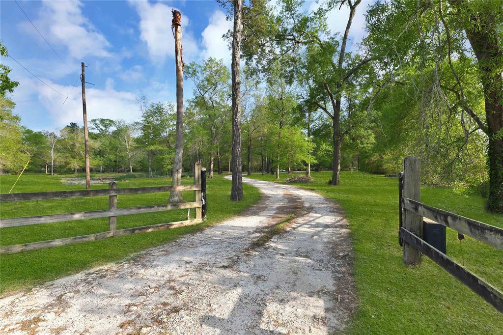 Pull in and ease your way through the well laid and designed acreage with improvements.