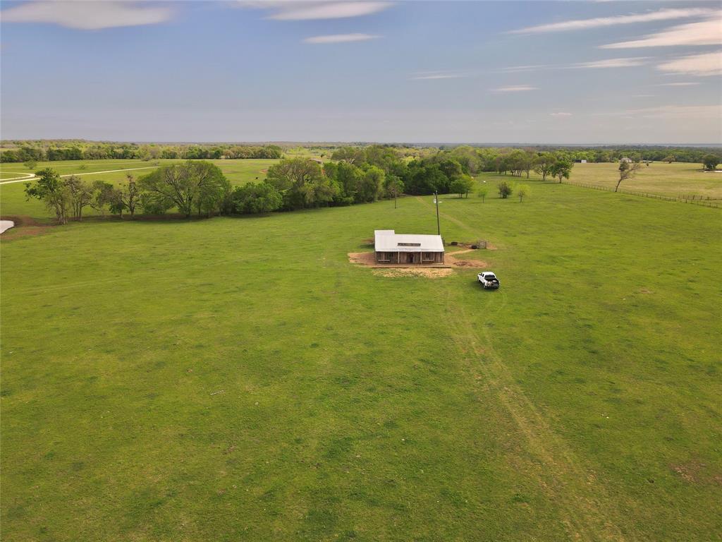 +/- 11 acres located just outside of Lexington on FM 696 East. This beautiful property has improved pasture, a pond, a working water well, electricity, and a Saloon. The 1200 SF Saloon would make a great mancave, party house, or workshop. An excellent spot for your dream home or a getaway cabin this property is conveniently located approximately 55 miles from Austin, 50 miles from Bryan/Collège Station, and 35 miles from Taylor, Texas and the new Samsung facility.