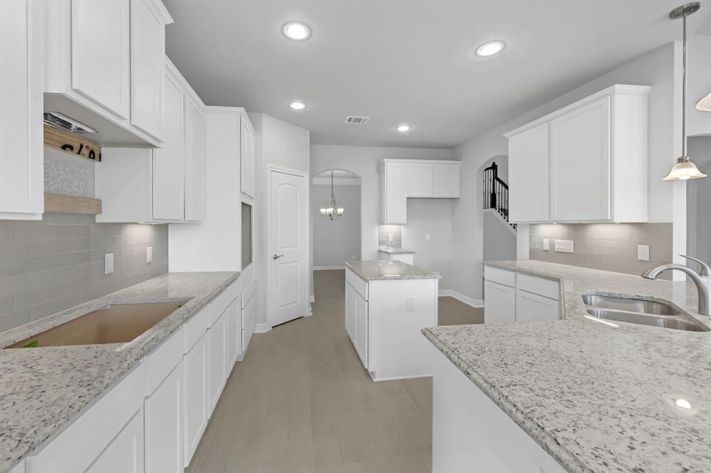 This kitchen will not disappoint! Your family and guests will enjoy many nights of fun, food and entertainment with ample counterspace and kitchen island for setting up a wonderful array of provisions.