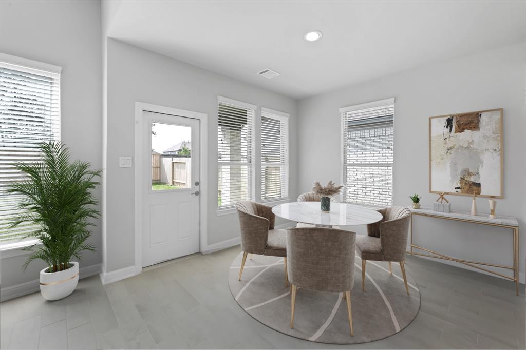 Start your day off right with a cup of coffee sitting with your family in the lovely breakfast area! Featuring large windows with blinds, custom paint and recessed lighting.