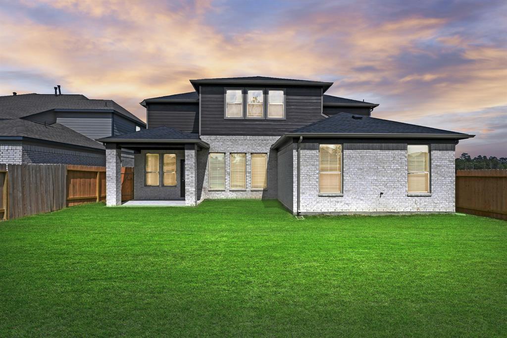 Come and see this spacious backyard with its beautiful covered patio. There is plenty of room for the kids to play and adults to relax! Perfect for your outdoor living space, patio furniture, bbq pit, and so much more. The possibilities are endless!