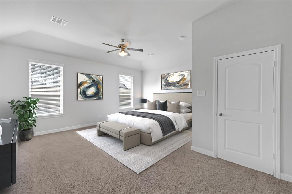 Come and unwind after a long day in this magnificent primary suite! This spacious room features plush carpet, warm paint, sitting area, high ceilings, ceiling fan, and large windows with privacy blinds.
