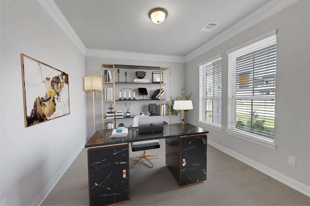 Quietly nestled in front of the home is the handsome home office. Featuring crown molding, custom paint and large windows with privacy blinds.