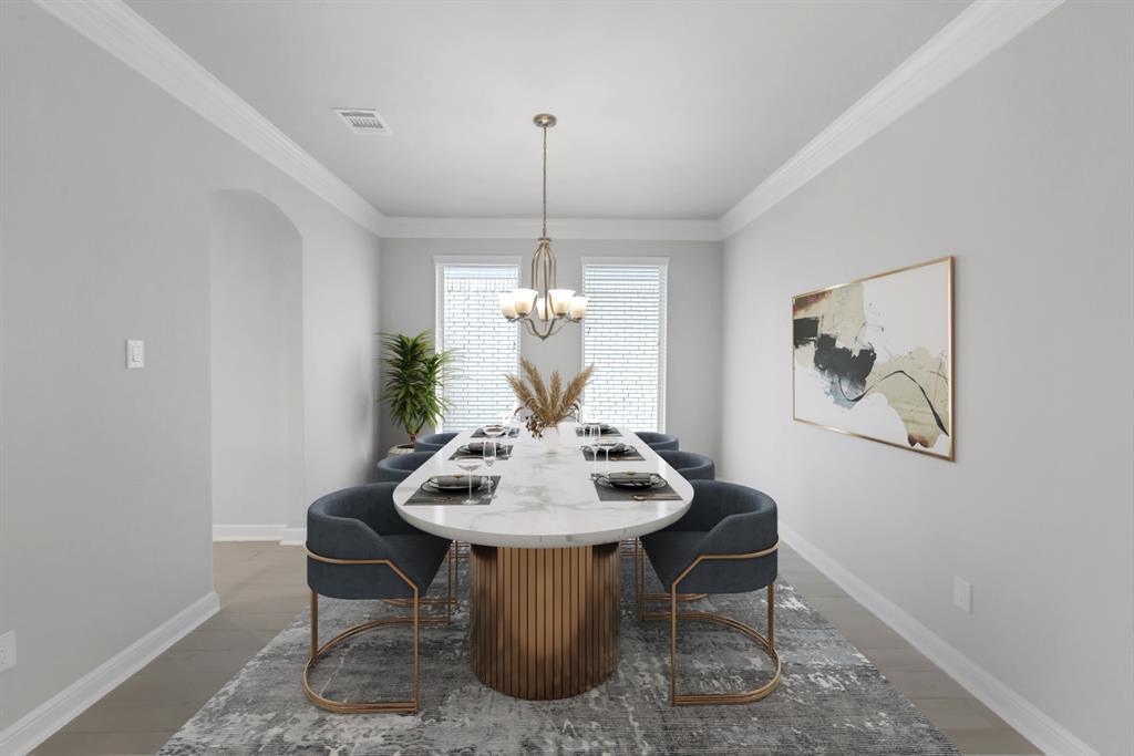 Make memories gathered around the table with your family and friends! This dining room features crown molding, custom paint, large windows with privacy blinds and chandelier.
