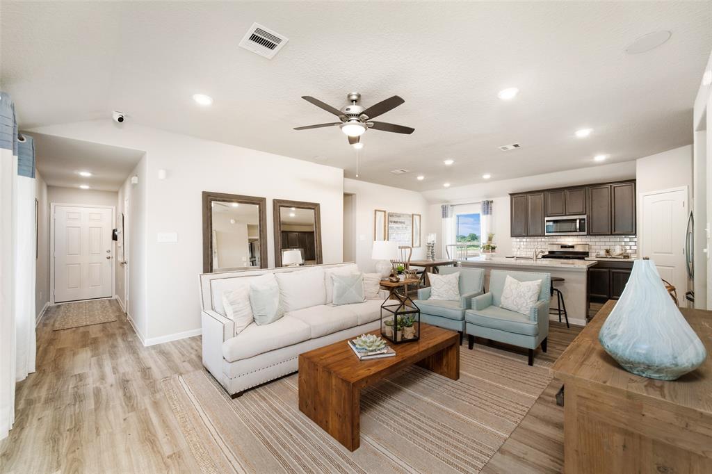 **Home is Under Construction. The photo shown here is of a completed home that has the same floor plan and similar elevation. Options and color selections may vary.**