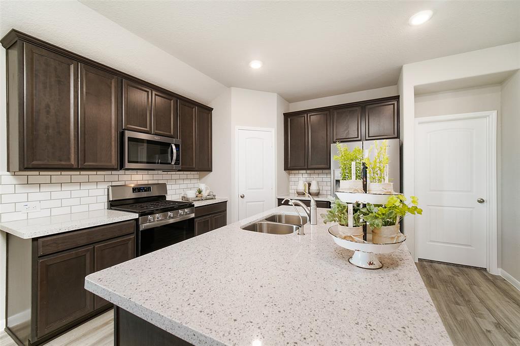 **Home is Under Construction. The photo shown here is of a completed home that has the same floor plan and similar elevation. Options and color selections may vary.**