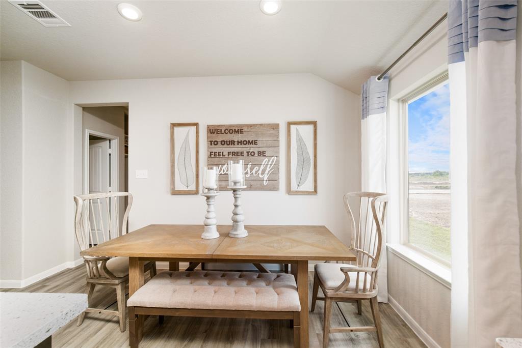 **Home is Under Construction. The photo shown here is of a completed home that has the same floor plan and similar elevation. Options and color selections may vary.**