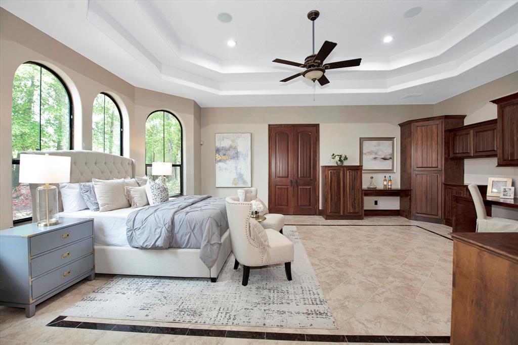 This bedroom/guest room is located downstairs and seperate from the living area. It has its own private bathroom and access to the balcony with beautiful views of the pool.