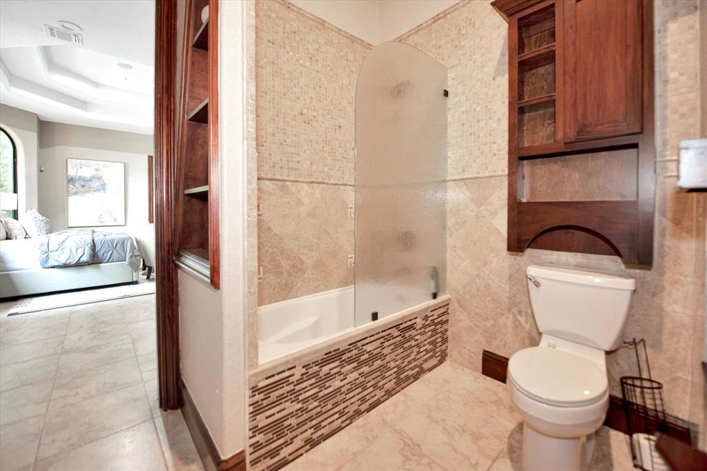 This is the guest bathroom and has access to the balcony.