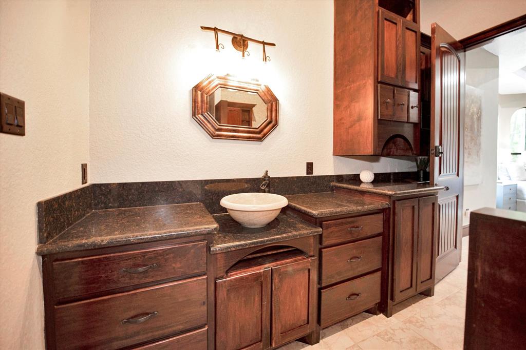 Guest bathroom downstairs with private access to the patio and pool.