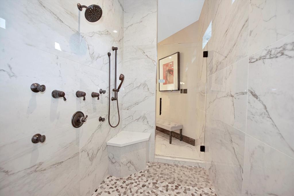 Walkthrough shower in primary bathroom.