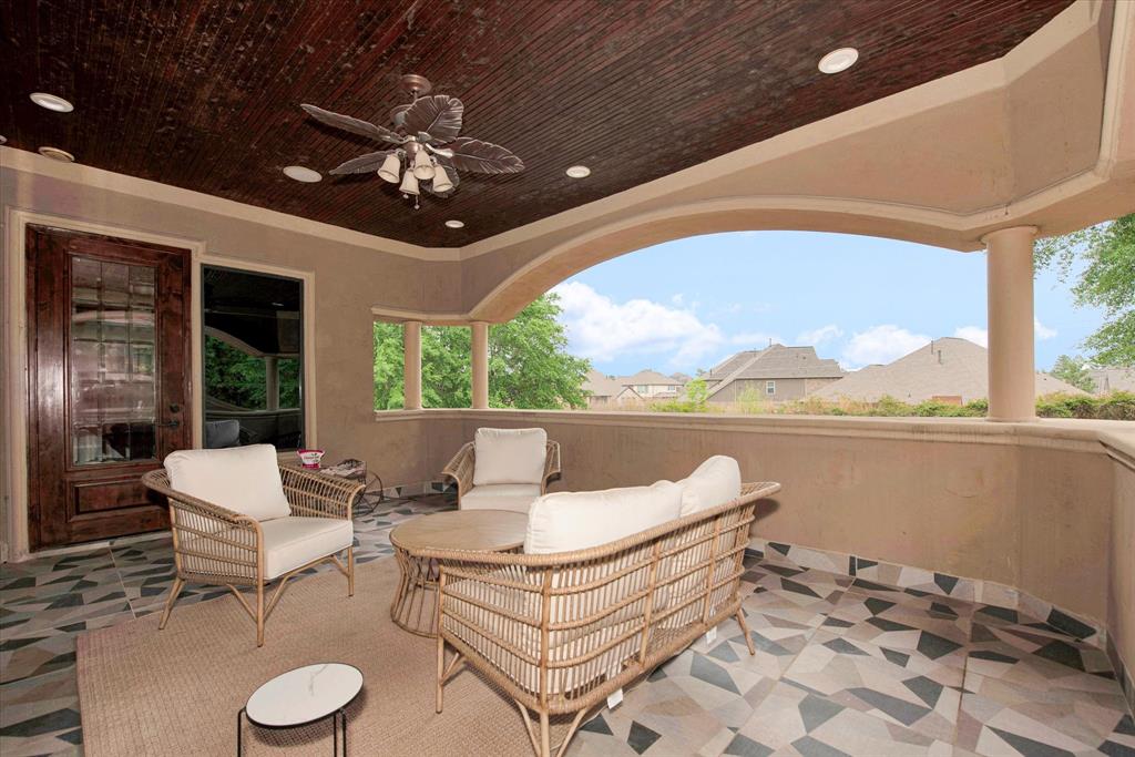 Balcony off the primary bedroom that overlooks the pool, grotto and 2 acre estate.