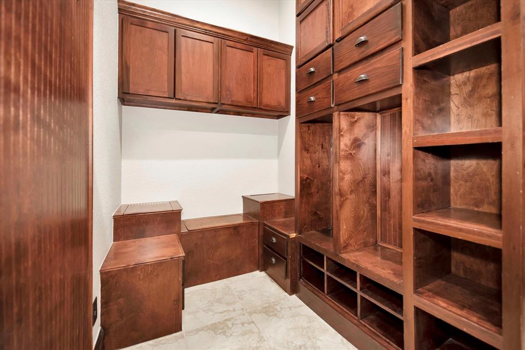 MUD area located right off one of the garages by your laundry room and living room.