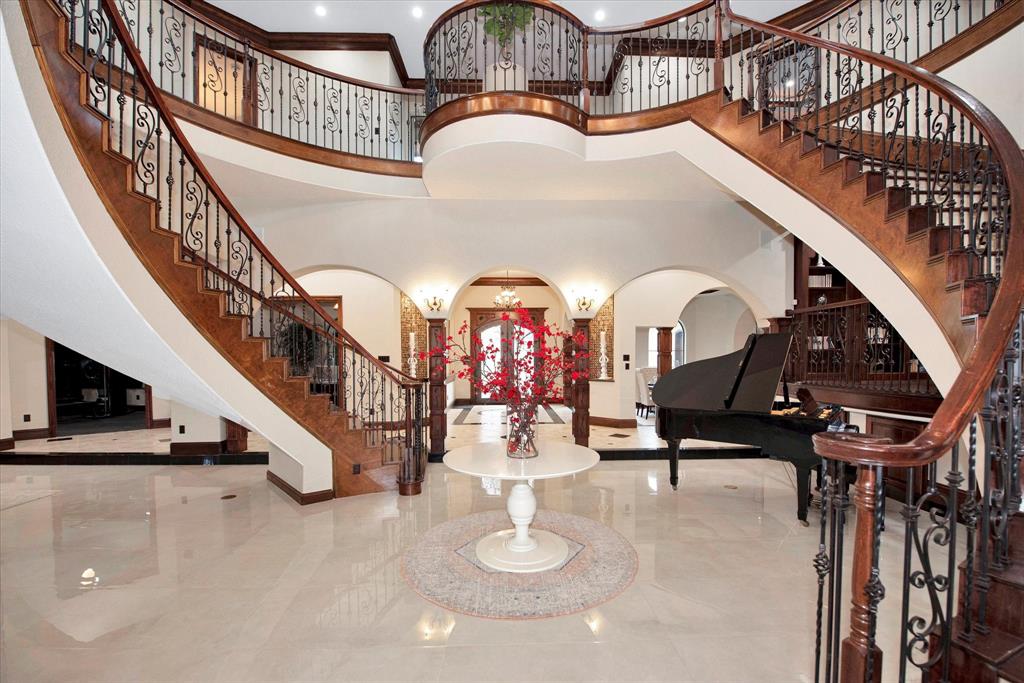 When you enter the foyer you are greeted by soaring high ceilings and two stair cases.