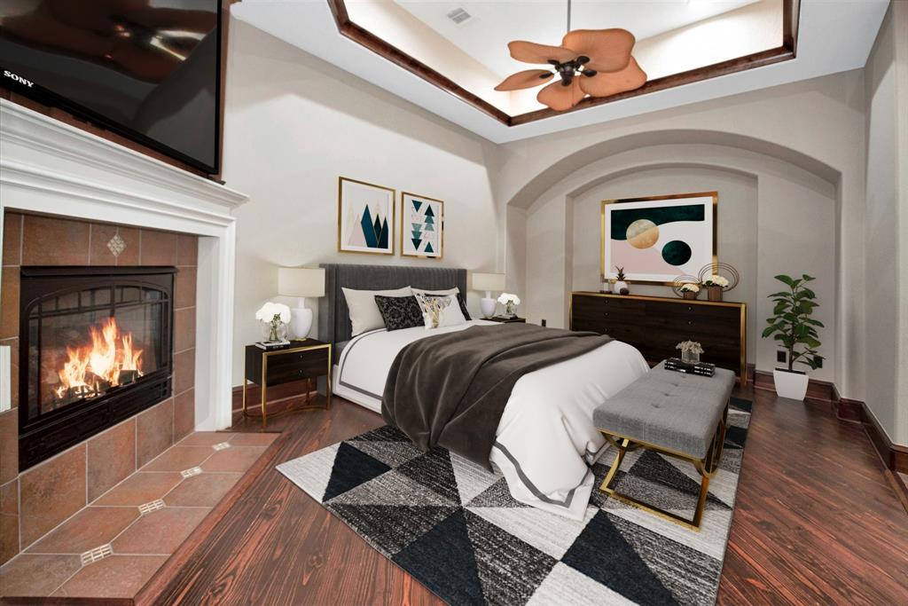 Secondary bedroom or second master. Features a large soaking tub and shower, fireplace and private access to the balcony at the front of the home. (Virtually Staged)