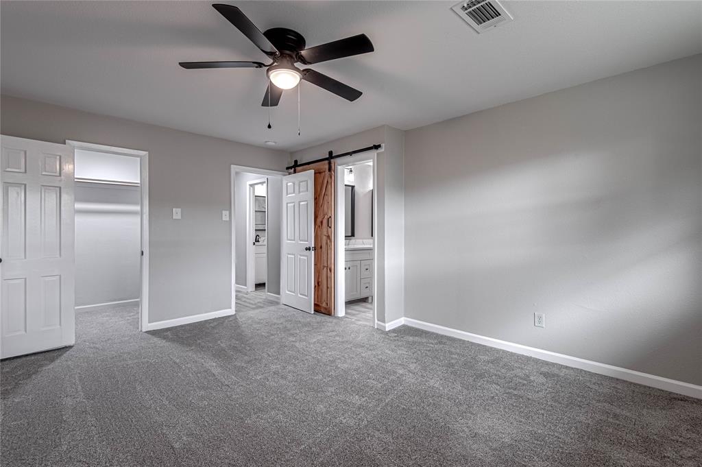 Beautifully updated Master Bedroom has a walk-in closet and private, en-suite bath.